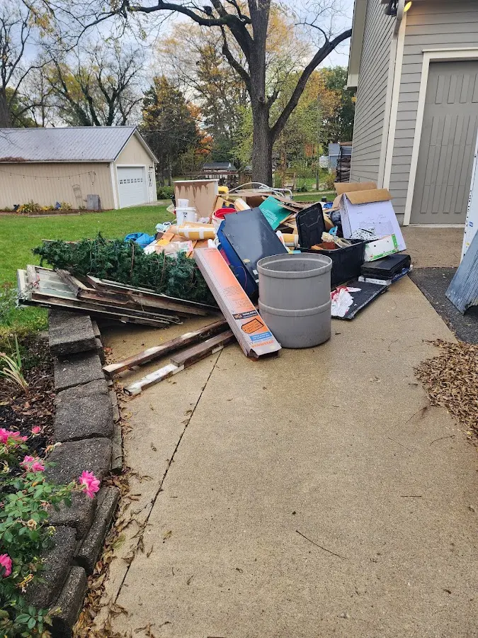 Dumpster being loaded with debris for Demolition Dumpster Rental in Livonia